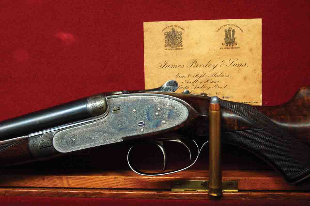 A .400 Purdey Straight (3) is shown in its original trunk case.